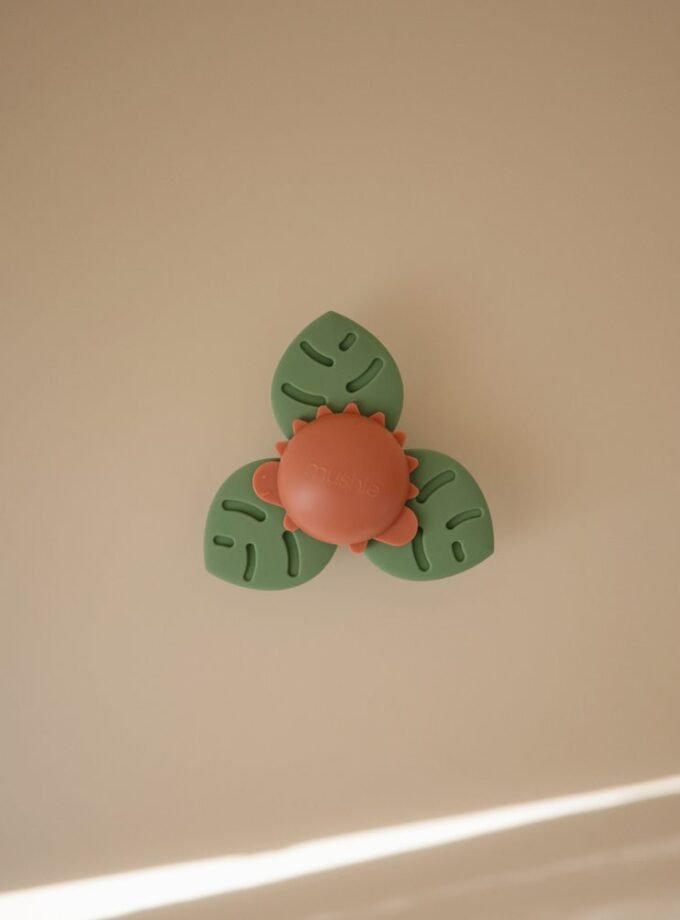 Mushie prilimpantis žaislas - Spinner - Dino